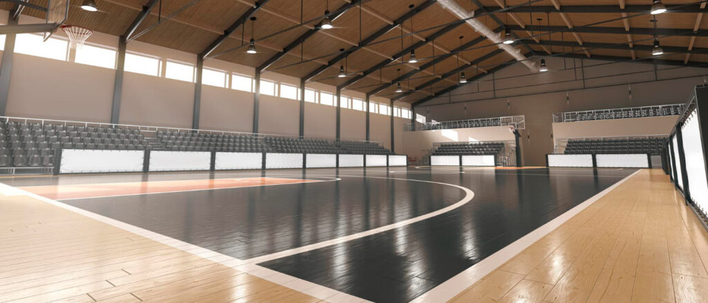 Pabellón de baloncesto con suelo deportivo de madera en Valencia.